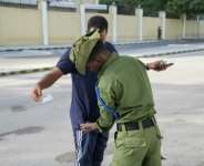 A soldier frisks a voter during the Mogadishu regions local polls.  By Hassan Ali ELMI (AFP)