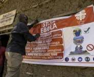 An Ebola awareness banner in the Kigonze camp for displaced persons in Bunia.  By Glody MURHABAZI (AFP)