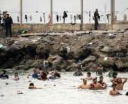 An unprecedented 72,000 people poured into Ceuta from Morocco from July 30, mostly by swimming.  By JORGE GUERRERO (AFP)
