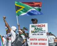 Anti-migrant protesters gathered outside the venue of a southern Africa regional summit.  By RAJESH JANTILAL (AFP)