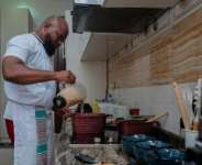 Archi Dimosi is part of a new generation of chefs taking ownership of traditional recipes in the Democratic Republic of Congo.  By Hardy BOPE (AFP)