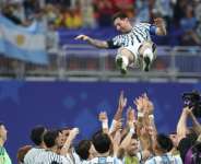 Argentina forward Lionel Messi is tossed into the air by team-mates after inspiring a late fightback in a 3-2 victory over Egypt. By Odd ANDERSEN (AFP)