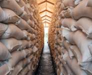 Bags of sorghum from the World Food Program sat in a warehouse in Maban, South Sudan, in August 2025. By GUY PETERSON (AFP/File)