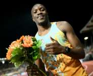 Botswanas Letsile Tebogo celebrates winning the mens 200m at the Lausanne Diamond League. By Fabrice COFFRINI (AFP)