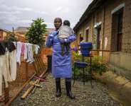 Caregiver Marie Bakikula looks after orphans of the DR Congos Ebola crisis. By MARIE RUWET (AFP)