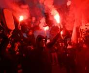 Demonstrators burn flares as they protest in Tunis.  By FETHI BELAID (AFP)