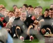 Erling Haaland led his Norway teammates in their Viking row celebration after they defeated Senegal to reach the World Cup knockout rounds.  By CHARLY TRIBALLEAU (AFP)