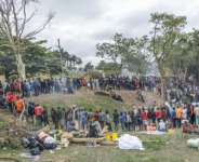 Foreign nationals, many of them Malawians, have streamed to a sports field in Durban, South Africa after fleeing a wave of xenophobic attacks. By RAJESH JANTILAL (AFP)