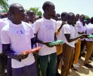 Former Boko Haram members hold the Quran at a reintegration ceremony a.  By Audu MARTE (AFP)