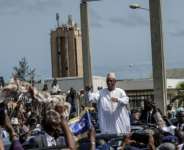 Former Senegalese president Macky Sall greets a crowd welcoming him on his arrival in Dakar.  By Patrick MEINHARDT (AFP)