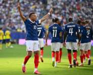 Frances Kylian Mbappe celebrates his teams third goal in a 3-0 victory over Sweden. By ANGELA WEISS (AFP)