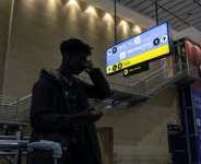 Ghanian national Silvester Boakye at O.R. Tambo international airport after Ghana delayed the evacuation of more than 800 of its citizens from South Africa.  By EMMANUEL CROSET (AFP)