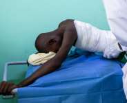 Hissen Ibrahim Abdelmadjid, 15, was treated at a hospital in Tine, Chad, after being caught in a drone attack across the border in Sudan.  By Joris Bolomey (AFP)