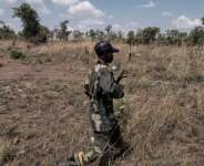 Local militiamen say they are paid to guard an artisanal gold mine in the southeastern DR Congo. By Camille Laffont (AFP)