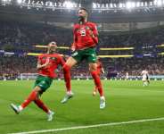 Moroccos policy of persuading dual nationals like Achraf Hakimi (L) to play for them has paid rich dividends. By PATRICIA DE MELO MOREIRA (AFP)