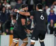New Zealand lock Patrick Tuipulotu (L) celebrates his try against Ireland in a 2026 Nations Championship match during July.  By Michael Bradley (AFP)