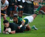 New Zealand wing Will Jordan scores his first try against South Africa in Johannesburg.  By PHILL MAGAKOE (AFP)