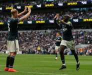 Newcastle United striker Yoane Wissa (R) celebrates after scoring against Tottenham Hotspur..  By CARLOS JASSO (AFP)