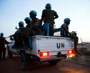 Peacekeeper troops from Ethiopia, deployed as part of the United Nations Interim Security Force for Abyei (UNISFA), patrol in a UN vehicle at night in Abyei town, Abyei state, on December 14, 2016.  By Albert Gonzalez Farran (AFP/File)