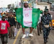 Protesters also marched in the streets of Lagos.  By TOYIN ADEDOKUN (AFP)