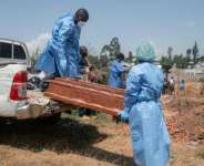 Red Cross personnel have conducted safe and dignified burials of Ebola victims.  By Jospin Mwisha (AFP)