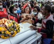 Relatives mourn at a memorial for victims of the Utumishi Girls Academy fire, the latest in a wave of such tragedies across Kenya. By Luis TATO (AFP)