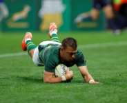 South Africa fly-half Handre Pollard scores a try against Georgia in Mbombela.  By PHILL MAGAKOE (AFP)