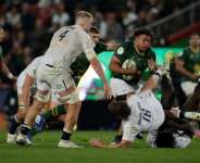 South Africa prop Zach Porthen runs with the ball against England at Ellis Park in Johannesburg..  By PHILL MAGAKOE (AFP)