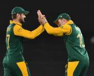 South Africas Rilee Rossouw (left) celebrates taking a catch with David Miller during a World Cup match against Ireland in Canberra on March 3, 2015. By Peter Parks (AFP)