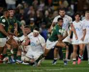 South African scrum-half Grant Williams leaves the England defence flatfooted to score..  By PHILL MAGAKOE (AFP)