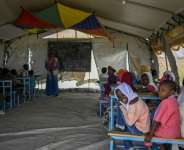Sudanese children attend class in a tent at a displacement camp. By Khaled DESOUKI (AFP)