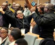 Supporters of Zambian President Hakainde Hichilema celebrated after election results showed he had won a second term.  By GIANLUIGI GUERCIA (AFP)