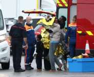 Survivors disembarked a rescue boat at the port of Calais, some on stretchers and in wheelchairs, many wrapped in emergency blankets.  By Sameer AL-DOUMY (AFP)