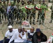 The six protesters were arrested outside parliament and had remained incommunicado since Thursday.  By Tony KARUMBA (AFP)