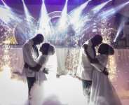 Twin brothers Taiwo and Kehinde Oguntoye dance with twin sisters Taiwo and Kehinde Adediran at their double wedding reception.  By OLYMPIA DE MAISMONT (AFP)