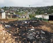 Two Mozambican nationals were killed and several houses torched after a march against undocumented foreign nationals.  By RODGER BOSCH (AFP)