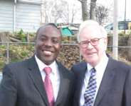 Chris Opoku-Agyeman poses with Warren Buffett