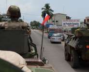 French soldiers are shown patrolling as part of the French Force Licorne in Port Bouet district of Abidjan, Ivory Coast on Saturday.