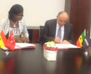 Mrs.Kate Quartey-Papafio and Remzi Gur signing the agreement.