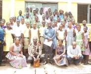 Hon. Emmanuel Kwasi Bedzrah and his officers in a group photograph with some beneficiaries and parents
