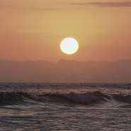 The sun sets over the Pacific Ocean, as seen from Huntington Beach, California on June 29, 2026. - Arafat Barbakh, Reuters