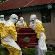 Members of a Congolese Red Cross team carry the coffin of a woman suspected of having died from Ebola in the eastern city of Bunia. By Jospin Mwisha (AFP)