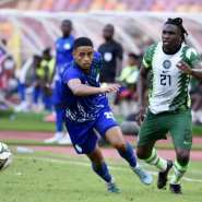 Sierra Leone forward Jonathan Morsay L is chased by Nigeria defender Calvin Bassey R during a 2023 Africa Cup of Nations Group A qualifier in Abuja on June 9, 2023..  By PIUS UTOMI EKPEI AFP