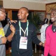 Yaw Ampofo Ankrah middle interviewing some football stars at a recent event
