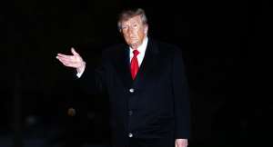 President Donald Trump waves while returning to the White House following a domestic trip in October. -  Nathan Howard, AP