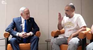 Israeli Prime Minister Benjamin Netanyahu meets Yaniv Hayun, a passenger on the FlyDubai flight bound for Israel from the United Arab Emirates, which was diverted to Saudi Arabia following an emergency signal, at the Ben Gurion Airport, Israel, October 1, 2026. -  GPO via Reuters
