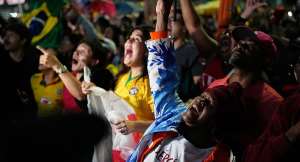 Supporters of President Luiz Inacio Lula da Silva, who is seeking reelection, cheer as presidential runoff results are announced in Sao Paulo, Sunday, Oct. 25, 2026. -  Natacha Pisarenko. AP