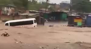 STC bus swept away by heavy floodwaters at Achimota–Abofu