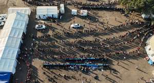 A drone view of thousands of Malawians at a Durban drive-in site amid fears of anti-immigrant violence ahead of a June 30 deadline set by activists demanding undocumented migrants leave the country, in Durban, South Africa, 25 June 2026. - REUTERS - Siyabonga Sishi