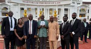Zenith University College Law Faculty members and the team displaying the award